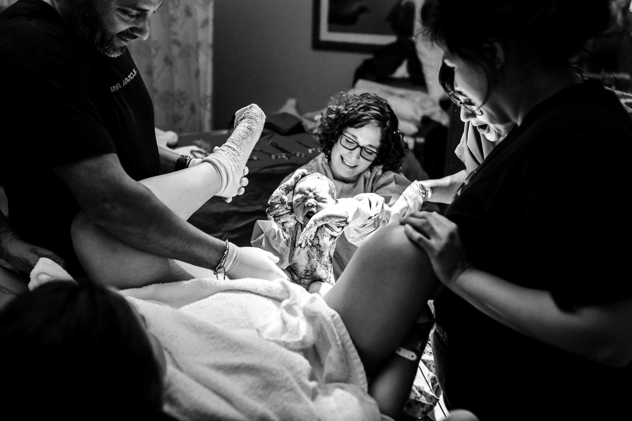 "Birth is so unpredictable, but the sweet sounds of a new crying baby always seem to bring a smile to everyone's face no matter what the struggles may have been. his first time mama tried so very hard to get her home water birth. After her transfer, she patiently waited to meet her sweet baby girl. That moment finally arrives and the entire room lit up with joy at the sight of this baby girl finally being earth side" Norma Hess Photography