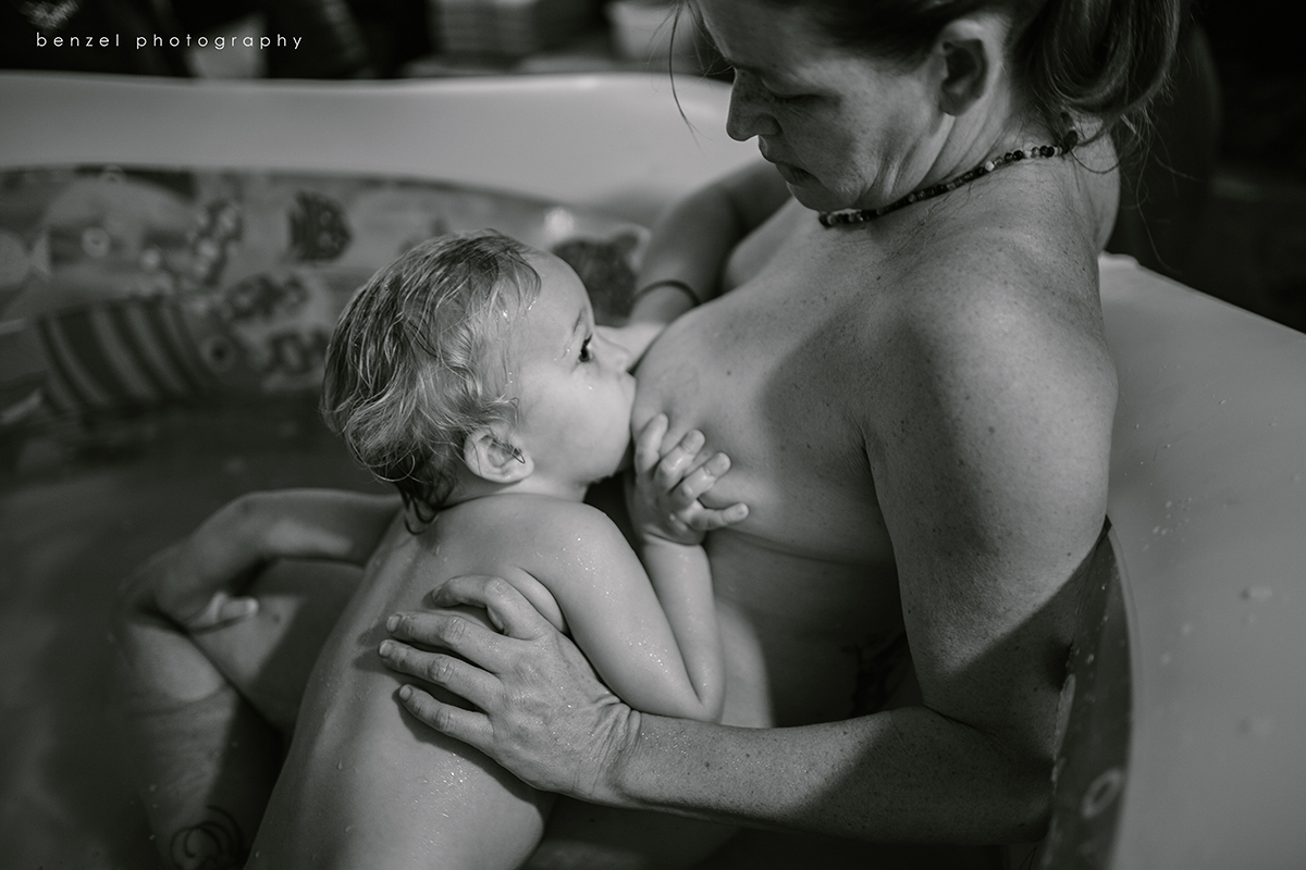 Son nursing during birth