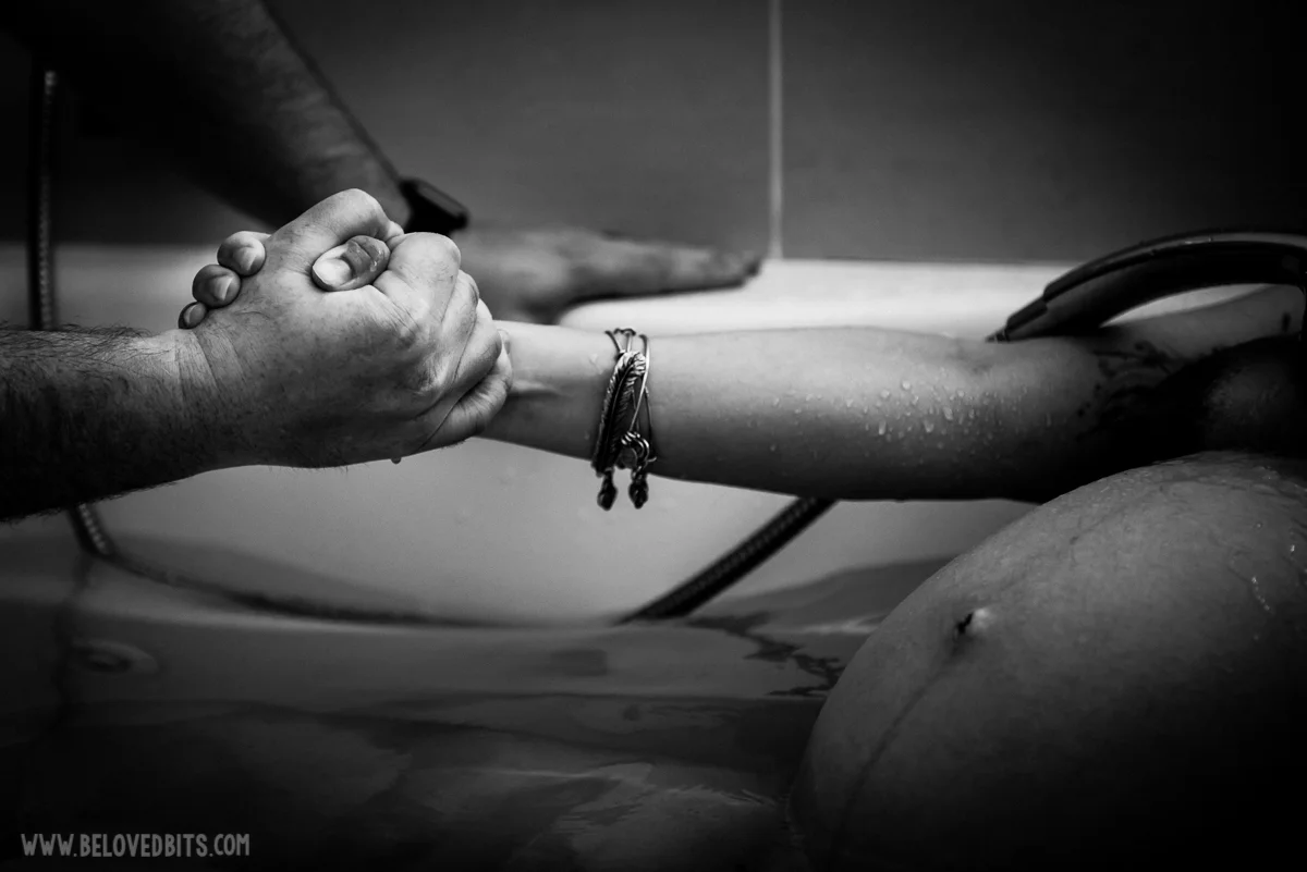 Holding hands during birth