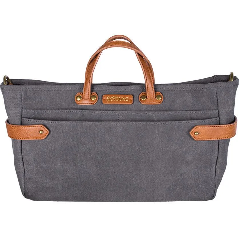 The Andi also has handles and a shoulder strap for carrying on it’s own. Both are retractable and removable when not in use.