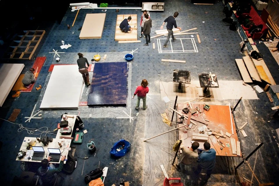 Volunteers build the new stage. Image Credit: Claudio Apicella