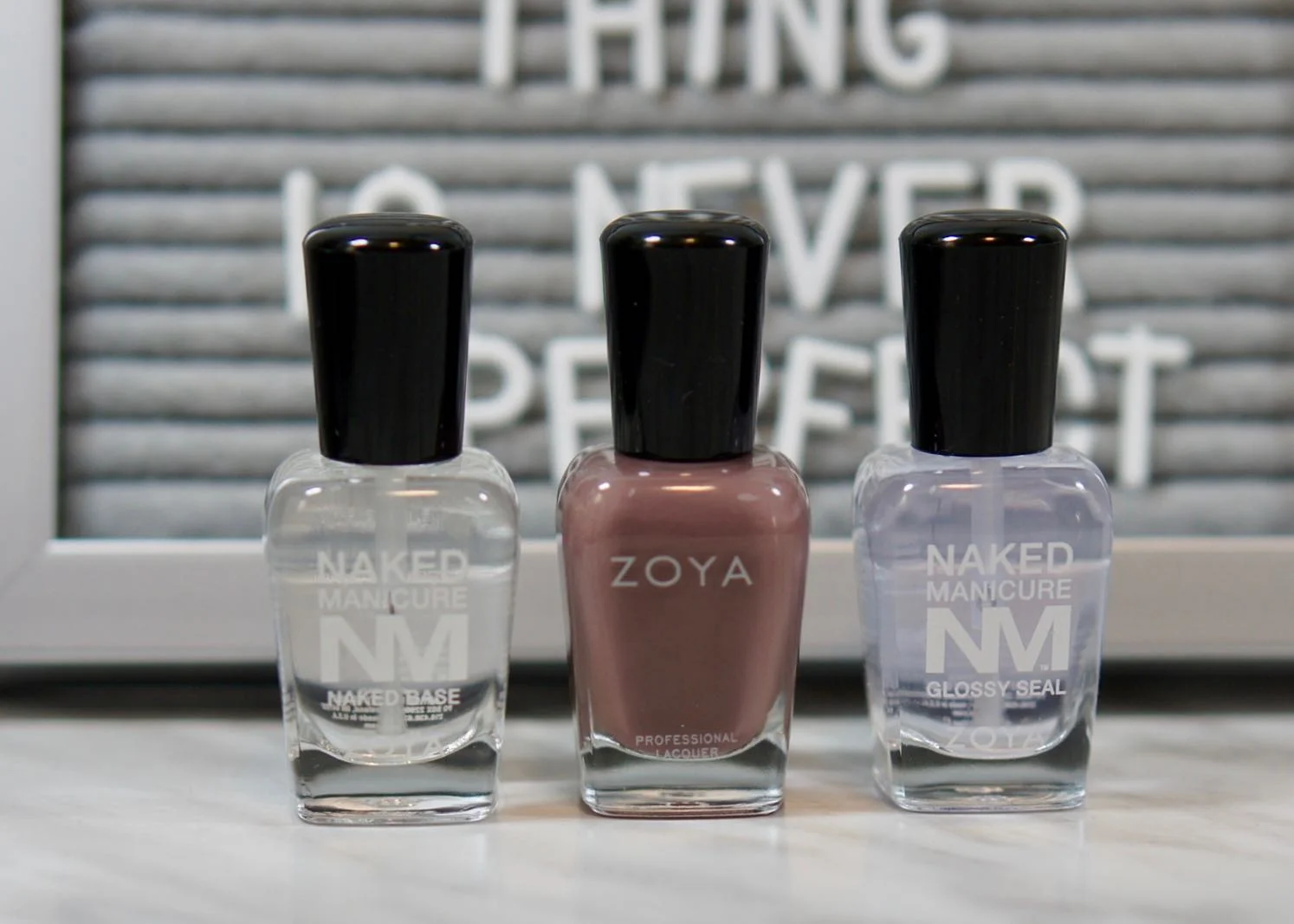 Zoya Naked Manicure Base Coat, Normani polish, and Naked Manicure Glossy Seal.