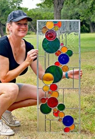 artist-holding-contemporary-stained-glass-transom.jpg