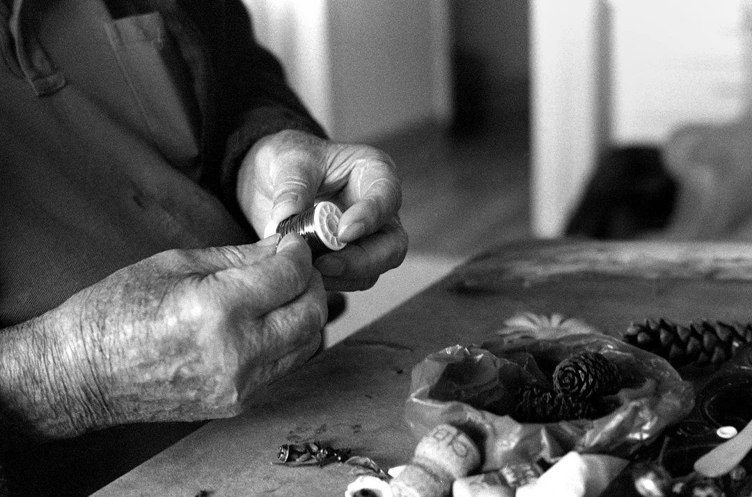 Larry working on a sculpture in his home, 2015