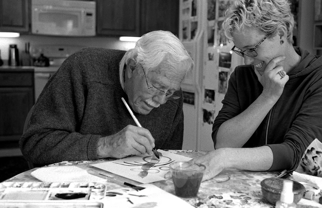 Roger and Amy working in Roger's home, 2015