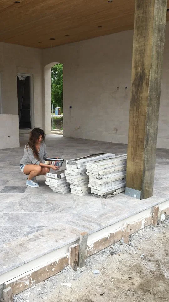 Jacquelyn Lindsey, Owner/Designer of JL Studio selecting grout colors for the new construction backyard 