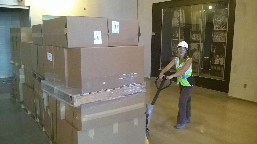 Erica maneuvering seats with the pallet jack. 