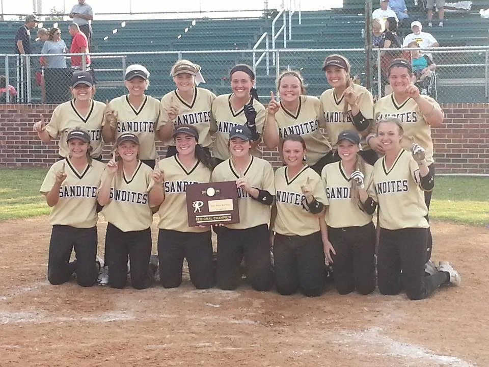The Sand Springs Lady Sandites showing off their Regional Championship plaque