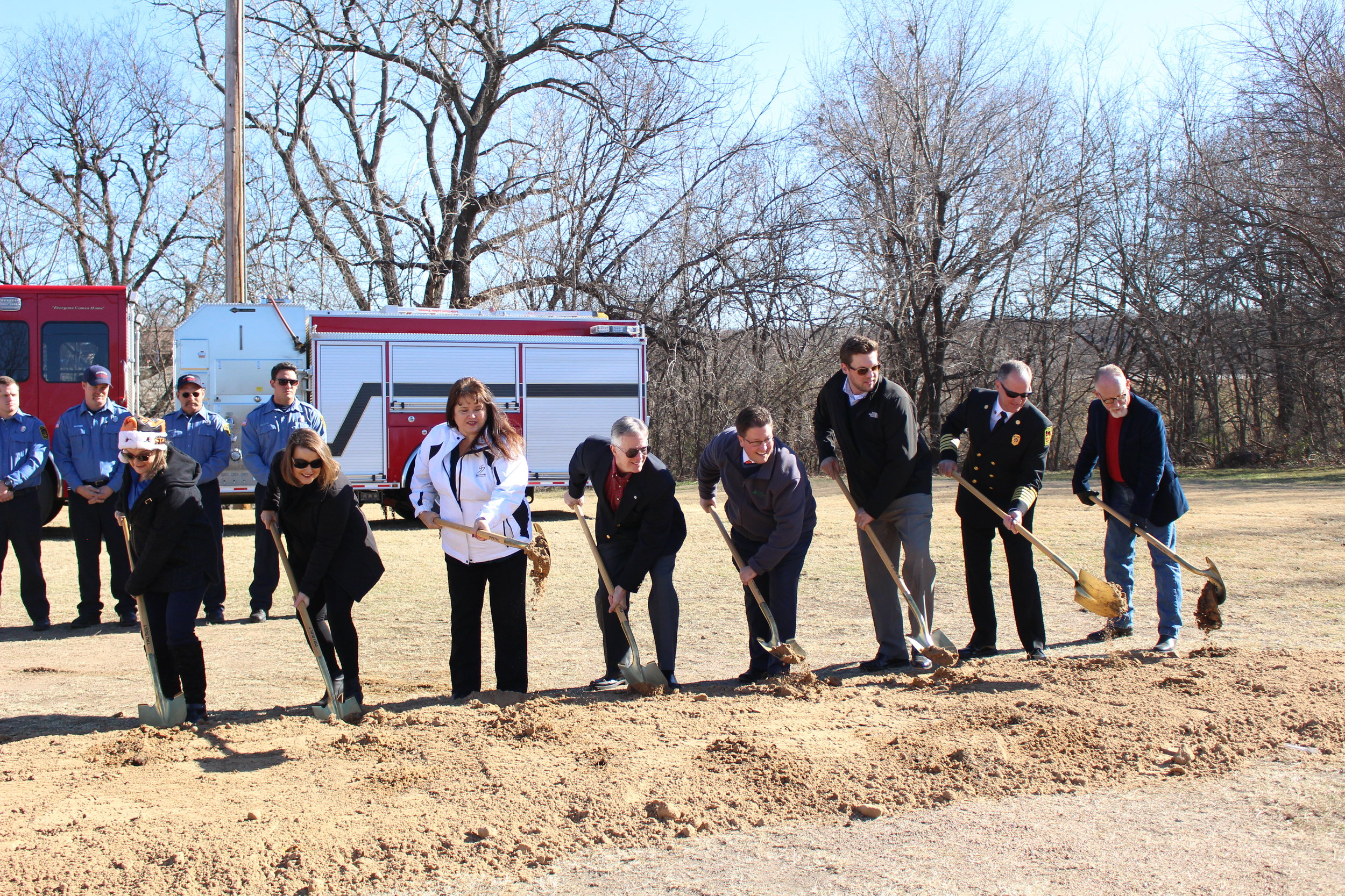 Members of the Sand Springs City Council, City Manager Elizabeth Gray, and Fire Chief Mike Wood turn dirt at the Fire Station No. 2 Ground-Breaking Ceremony. 