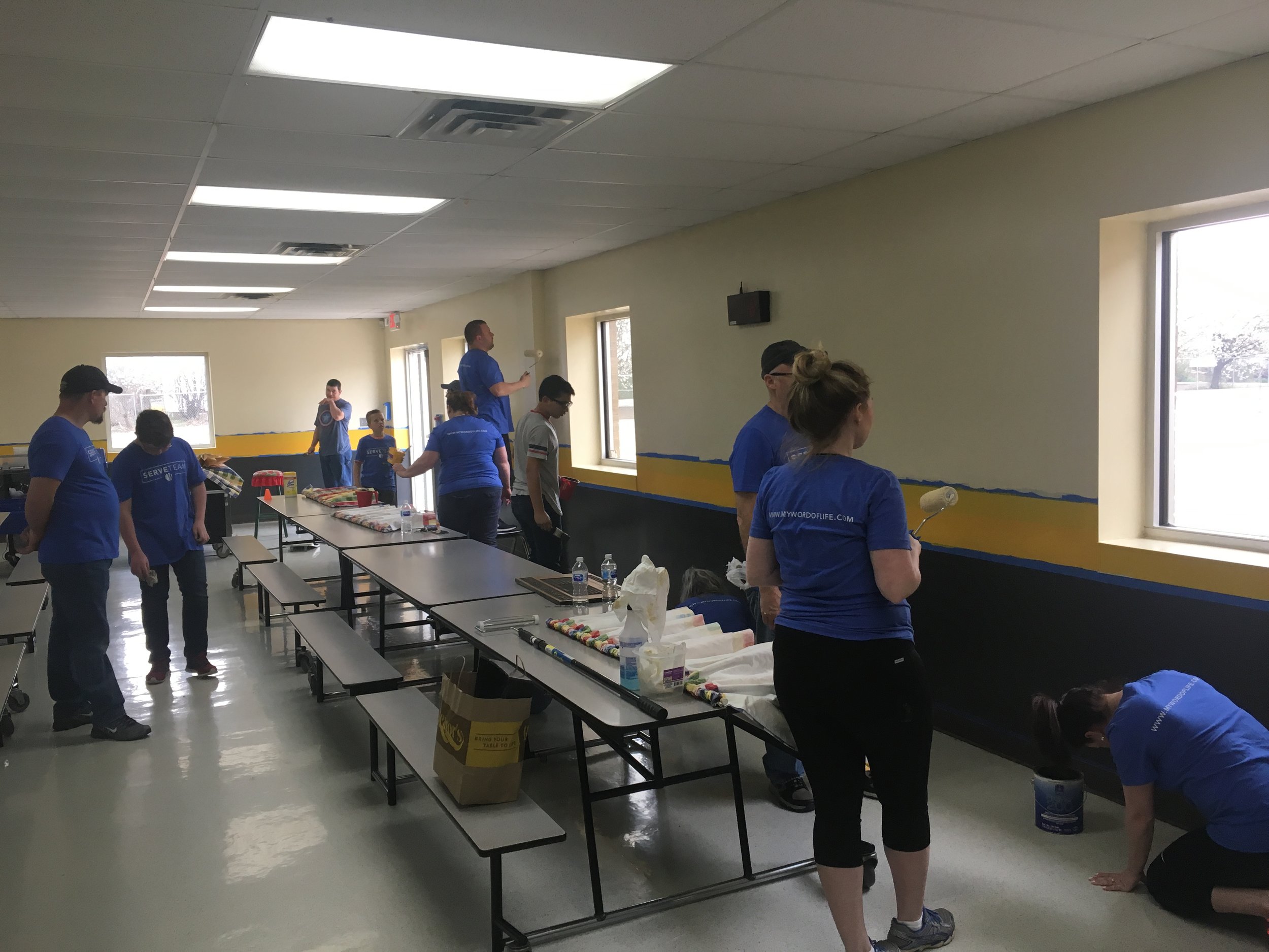  Forty Word of Life volunteers spent several hours painting the Limestone Technology Academy cafeteria Sunday after church. (Photo: Scott Emigh). 