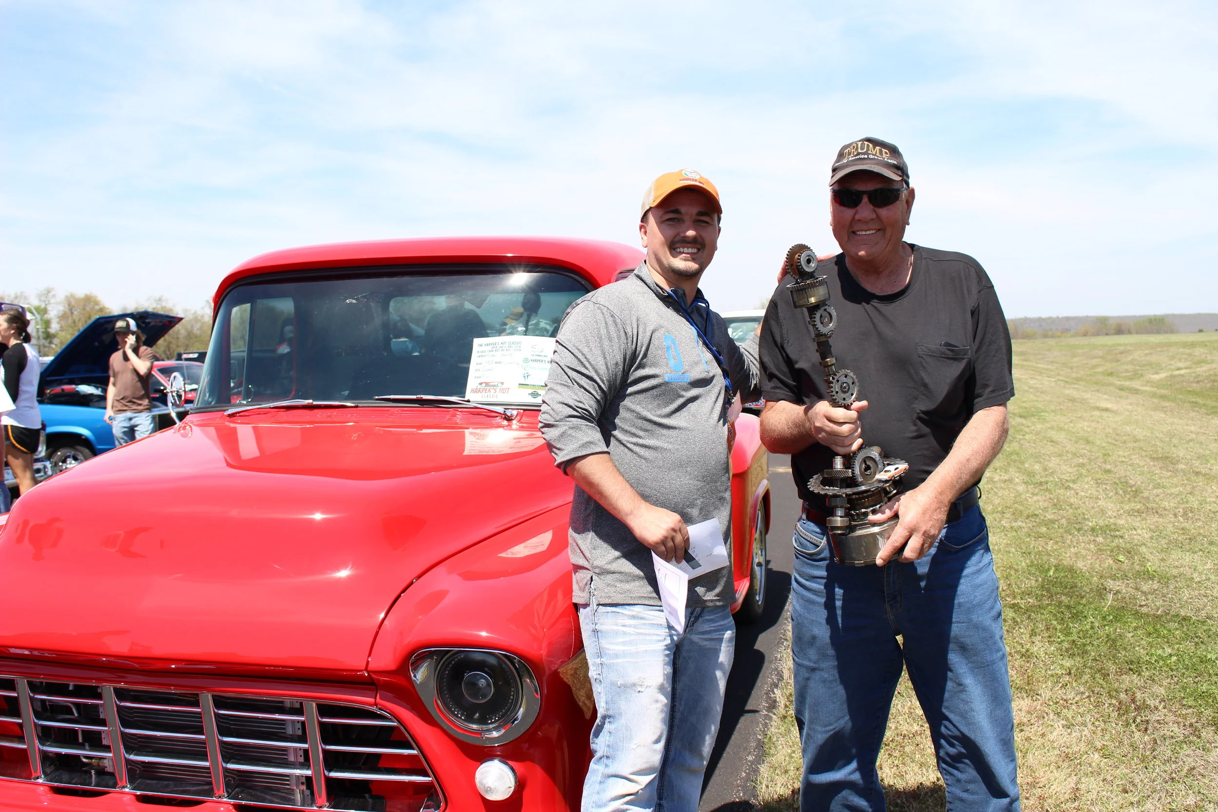  William Nozak presents a trophy to a winner at the 2017 Harper's Hut Classic Car Show. 