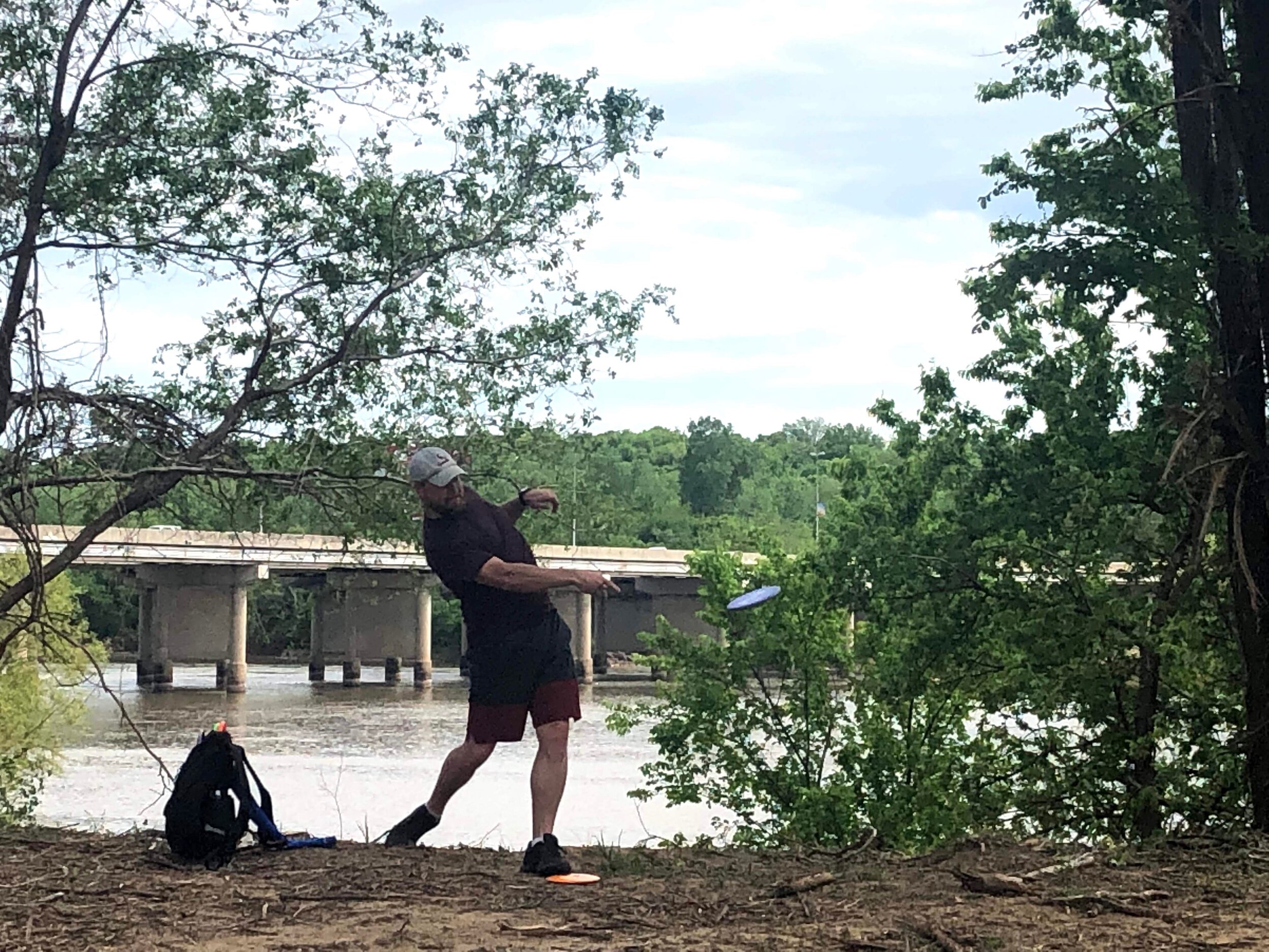 Dwight Griffis throws an up-shot on Hole 15 at the River City disc golf course.