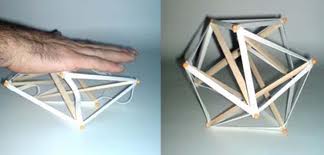 Tensegrity model being distorted and springing back to life.