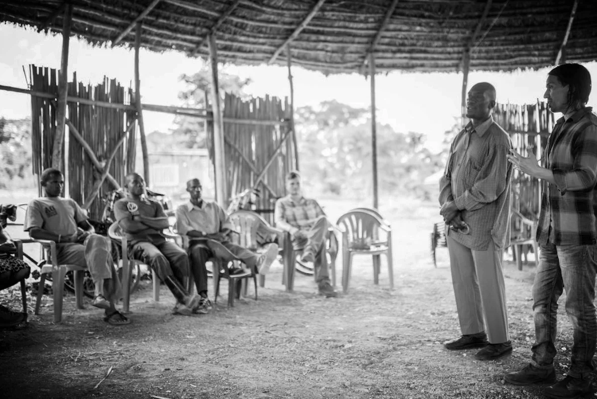 Gregg in Africa talking to local community leaders about sustainable development.
