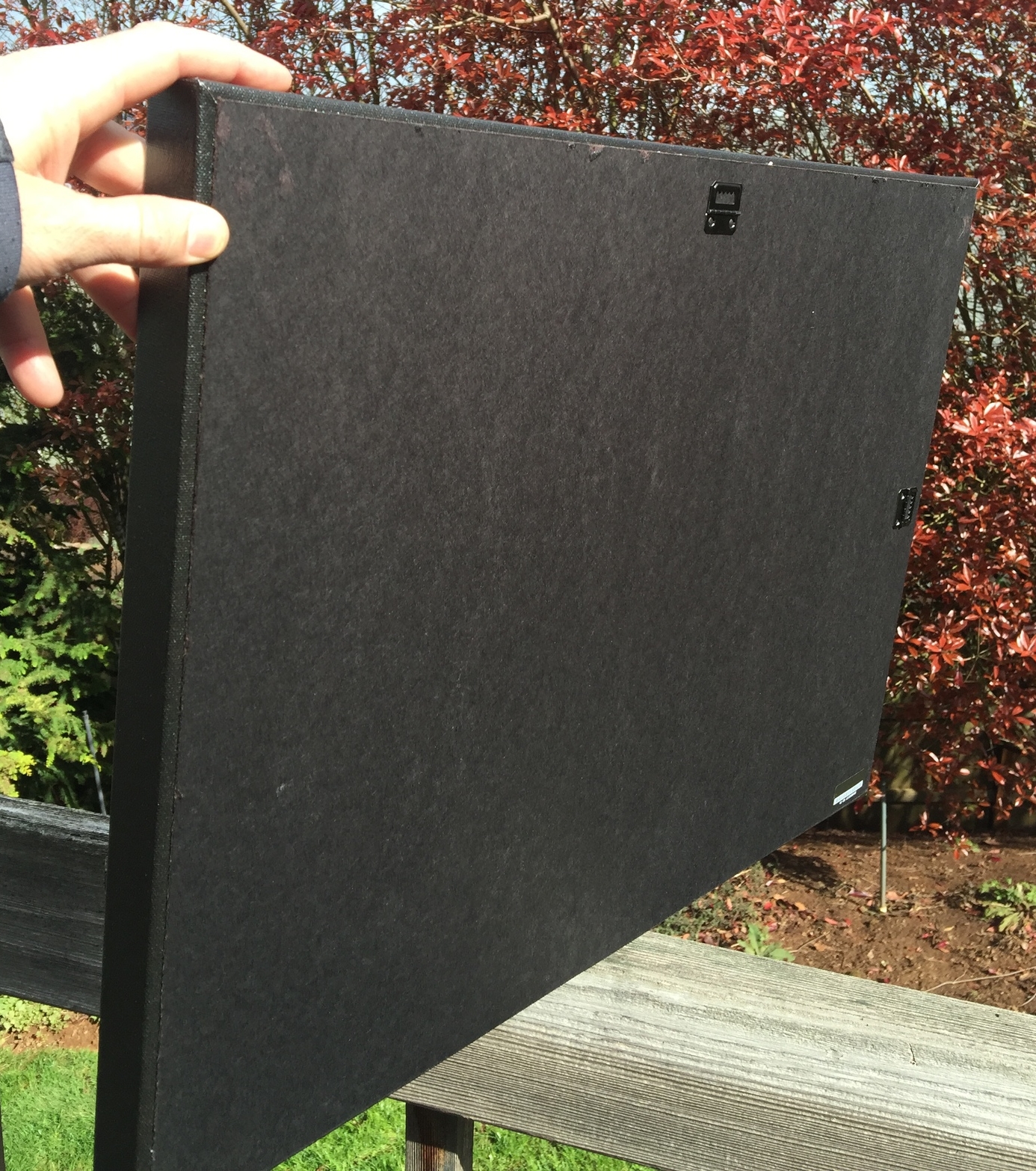 All canvas come board backed and have hangers mounted on the back to help out with hanging them level.