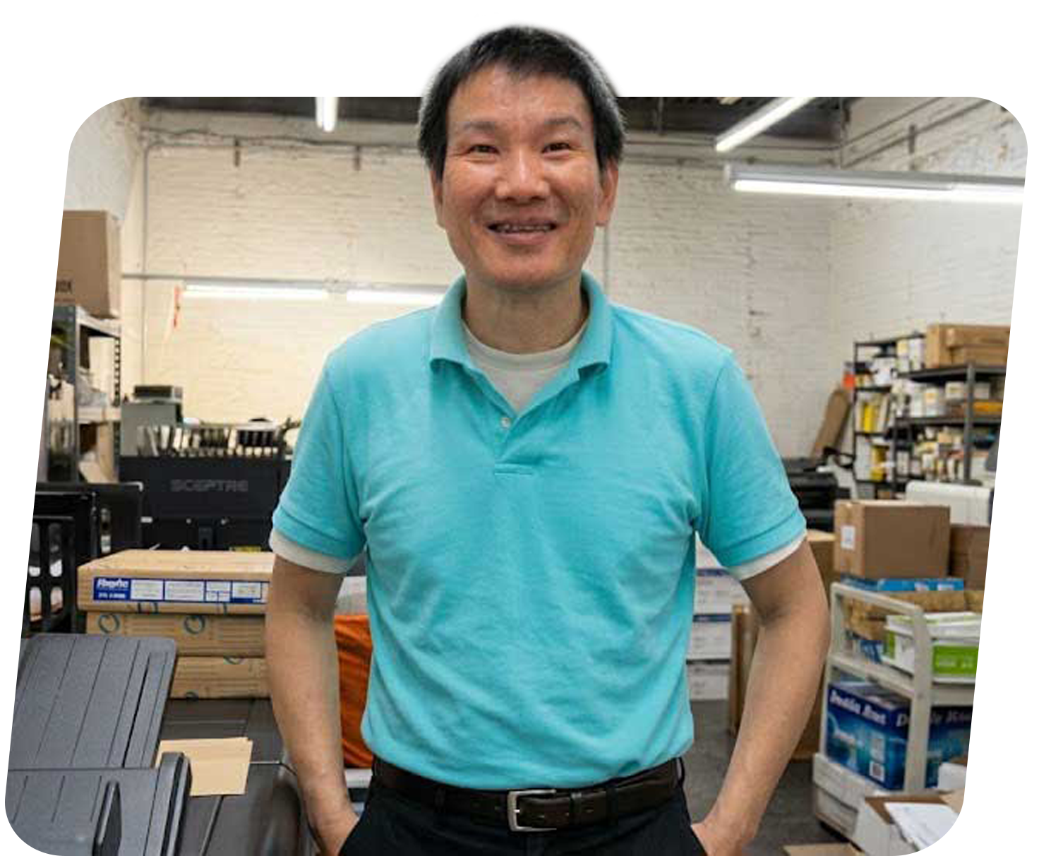 Business owner Ken, Post Heritage stands in the printing company located at Brooklyn, NY