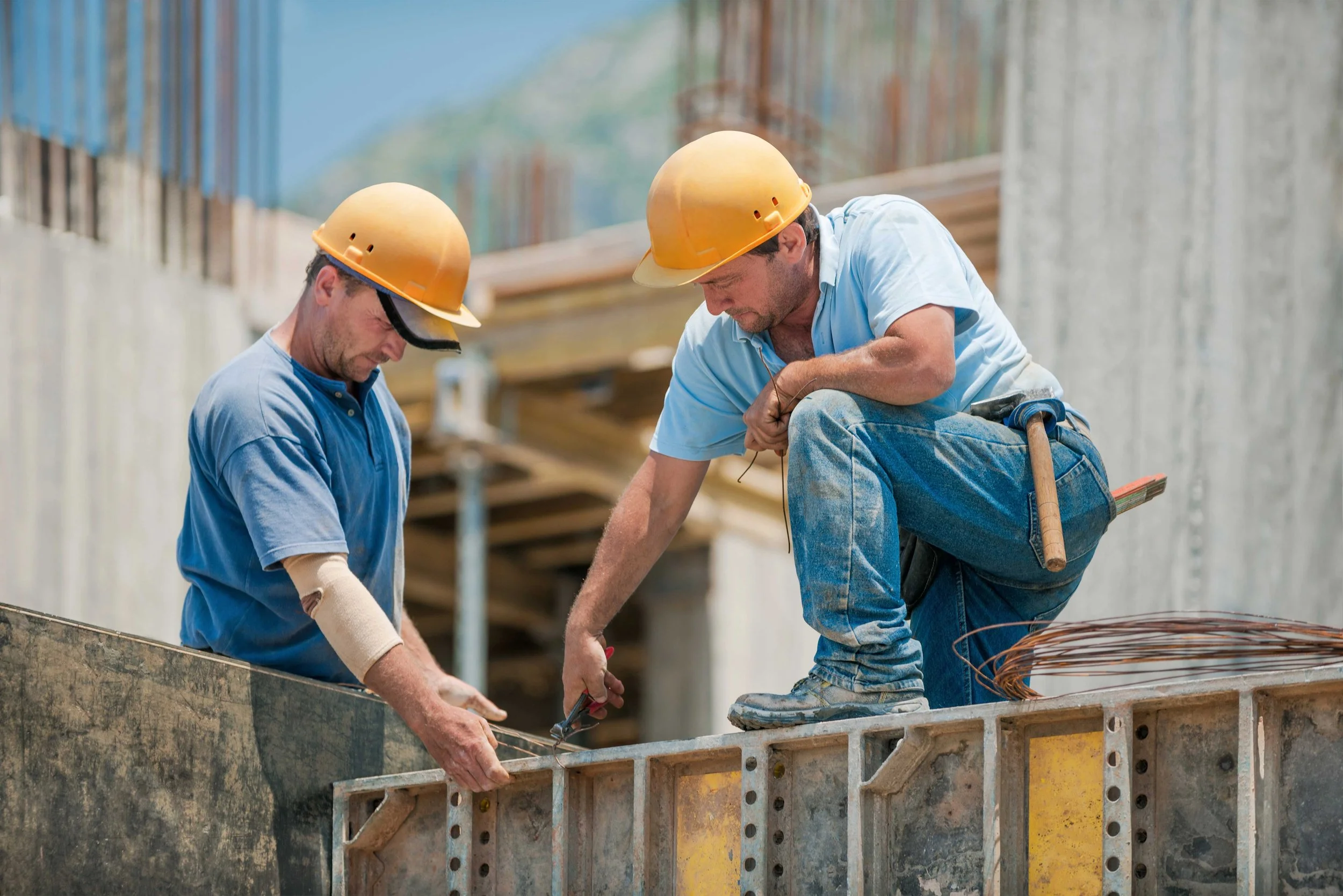 Construction workers inspecting the job site.