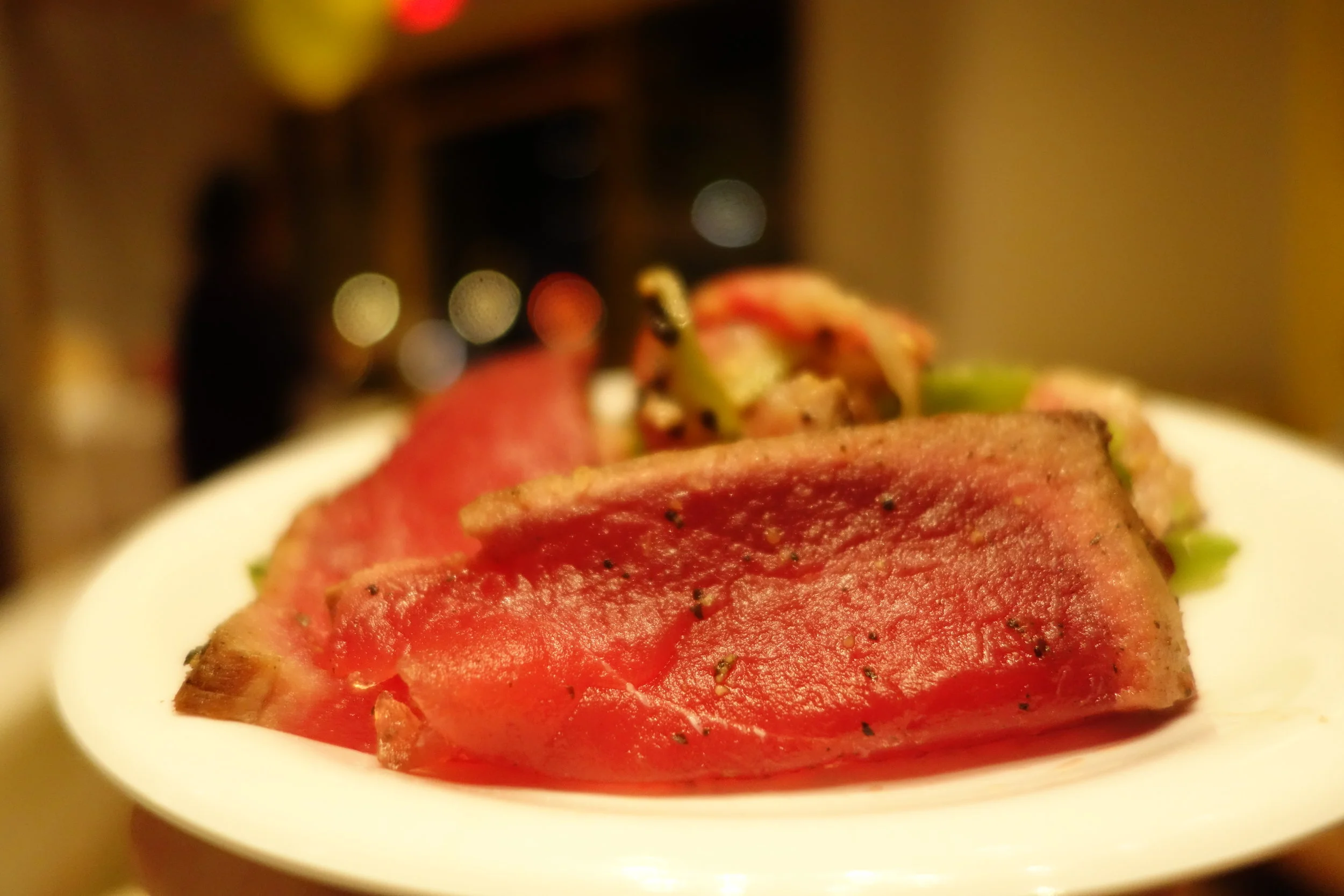 Seared Ahi Tuna with crushed orange-ginger ponzu.