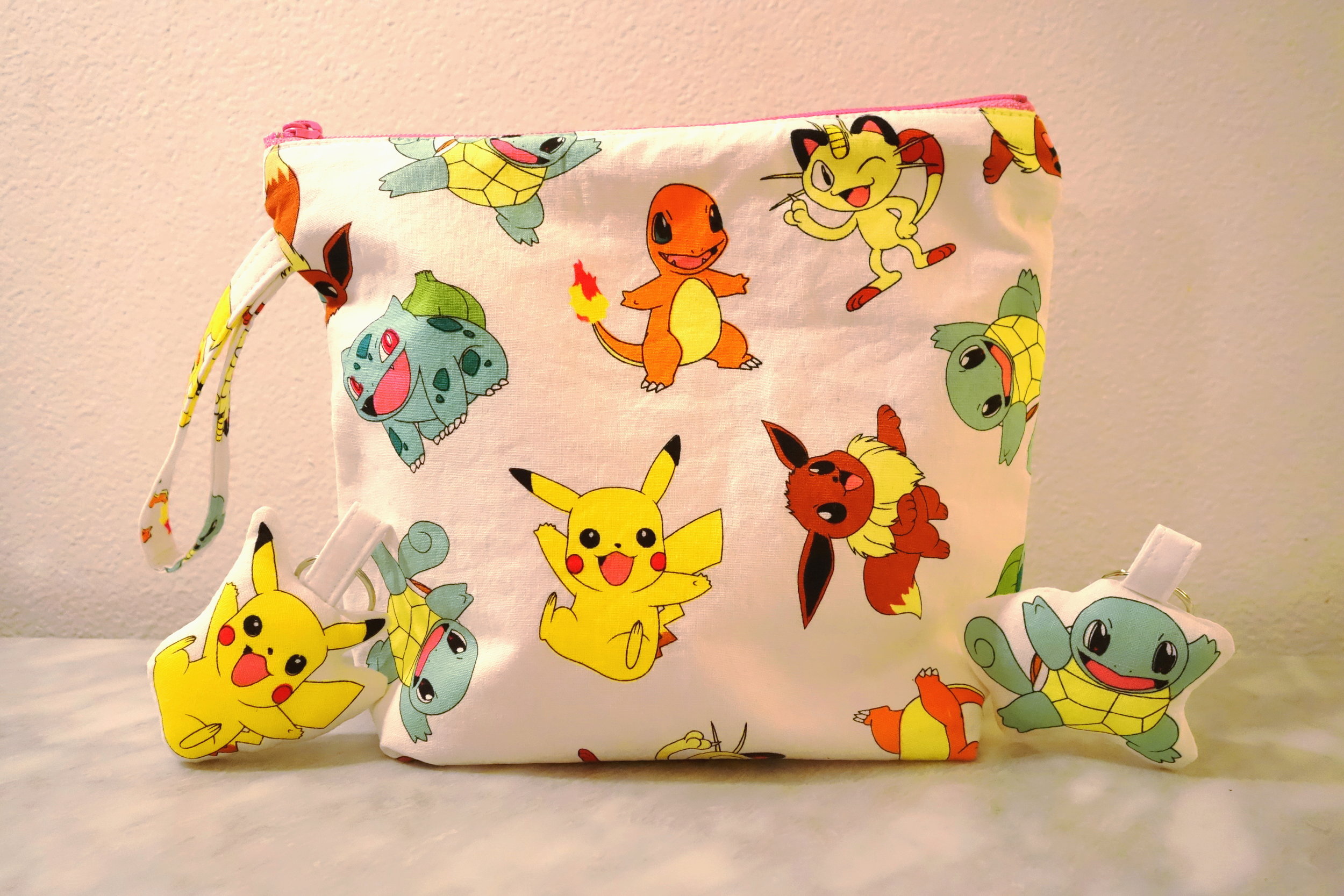 Pokemon Bag (Center), Pikachu Pillow Keychain (Left) & Squirtle Pillow Keychain (Right)