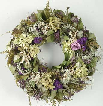 Summer greens and purple give this lovely wreath a natural, earthy feel