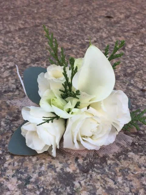 The best part of the whole wedding - a boutonniere for the couple's dog!