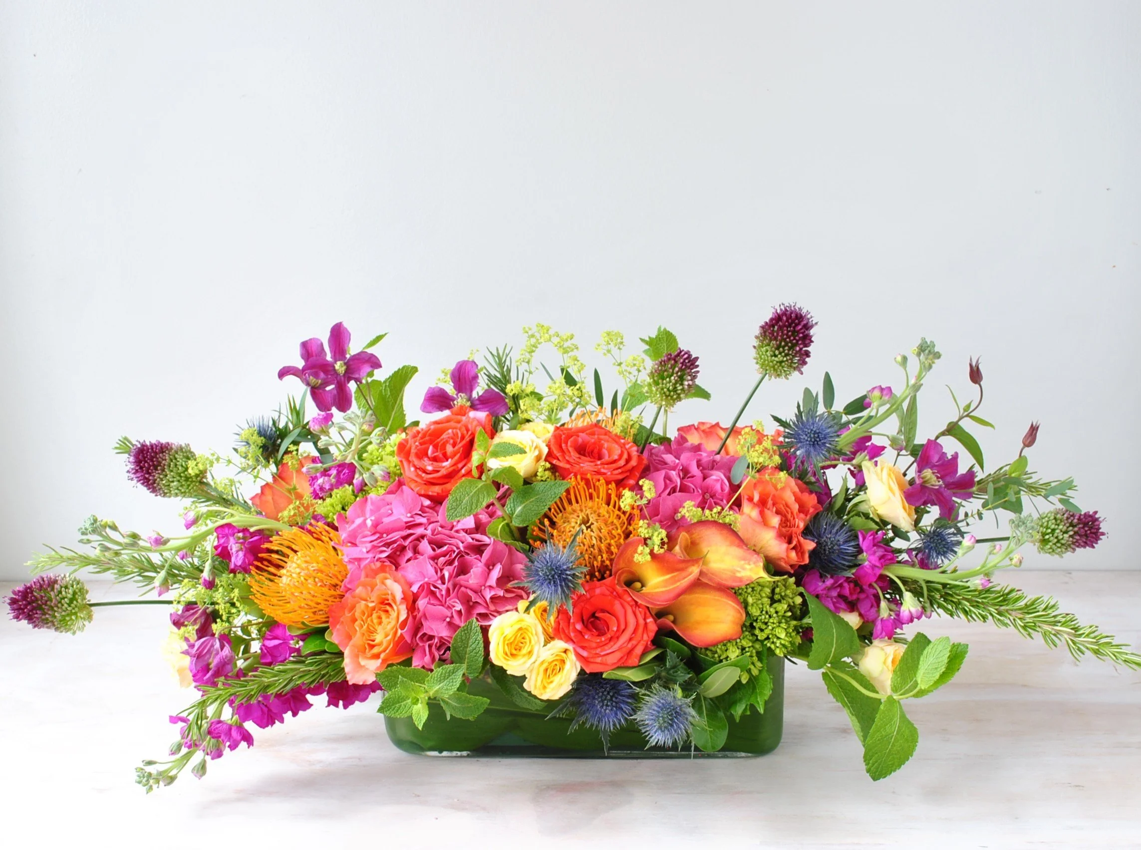 long and low centerpiece for dining table event and host deliveries