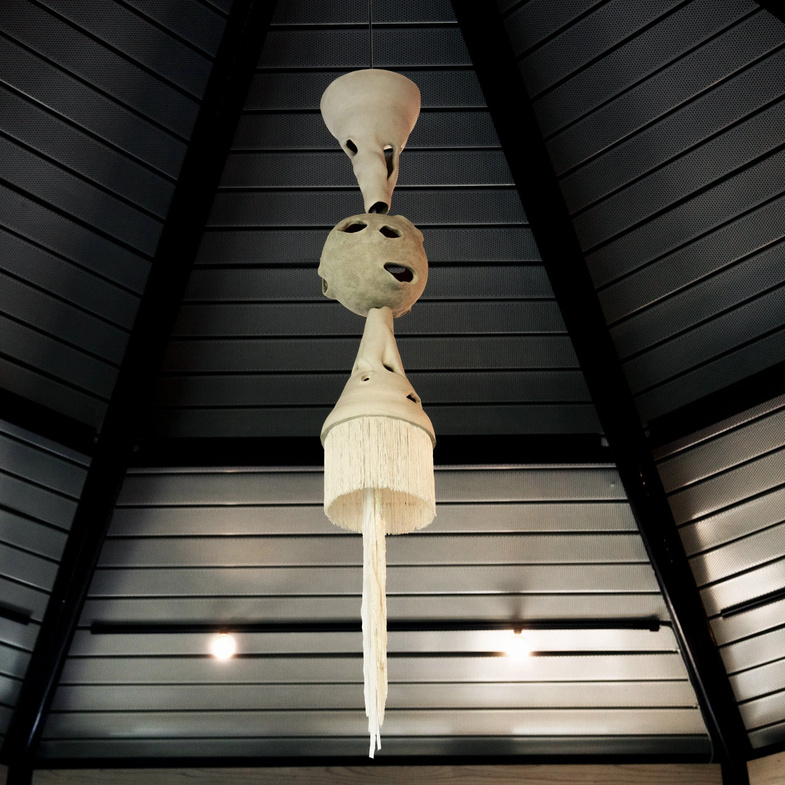 Central Totem - Installation View, Totems at The Umlauf Sculpture Museum and Gardens, Porcelain, Spanish Shawl Tassel, Mother's Clothing, Photo Credit: Ian Clennan