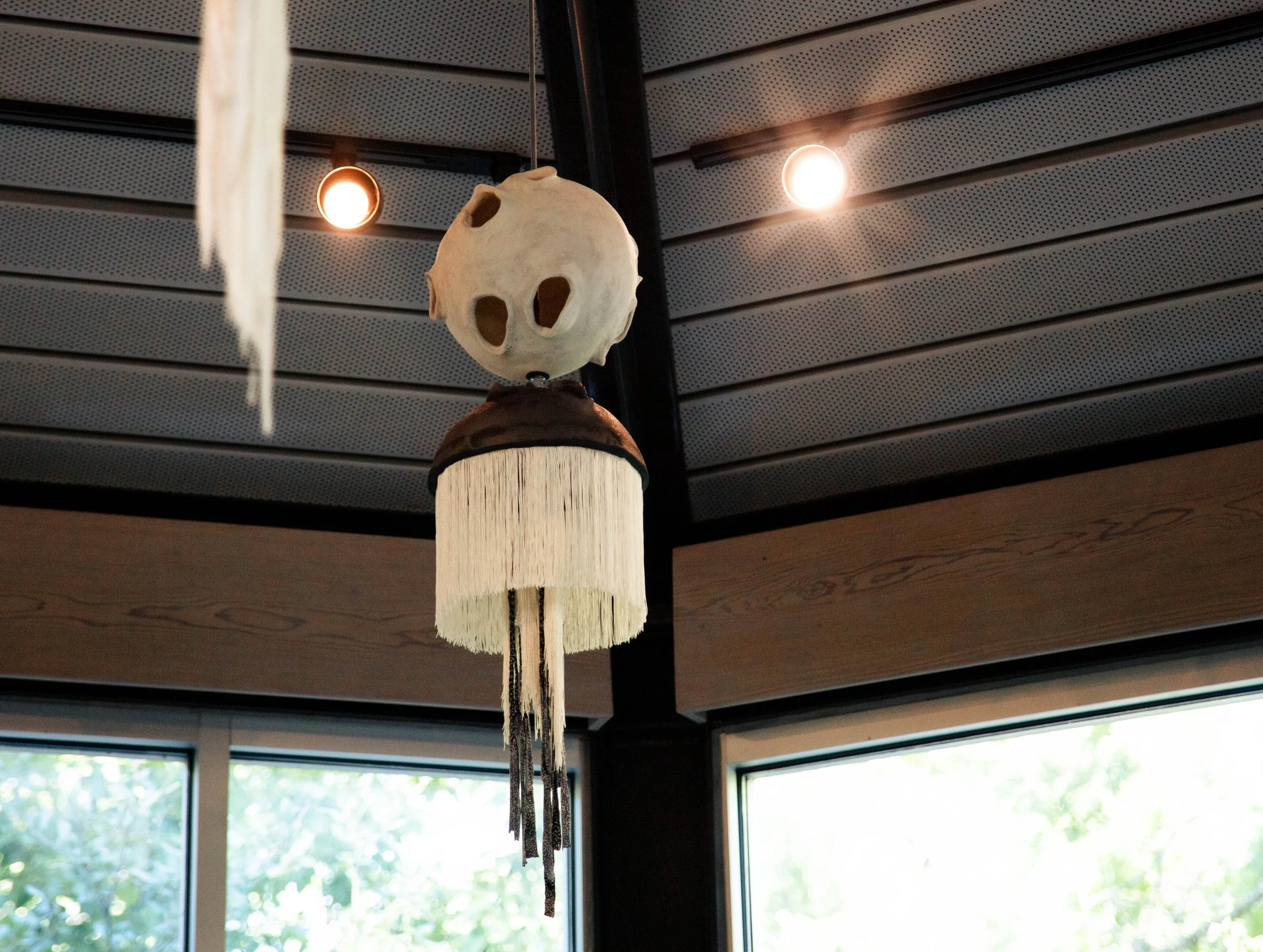 Right Facing Totem - Installation View, Totems at The Umlauf Sculpture Museum and Gardens, Porcelain, Spanish Shawl Tassel, Mother's Clothing, Photo Credit: Ian Clennan