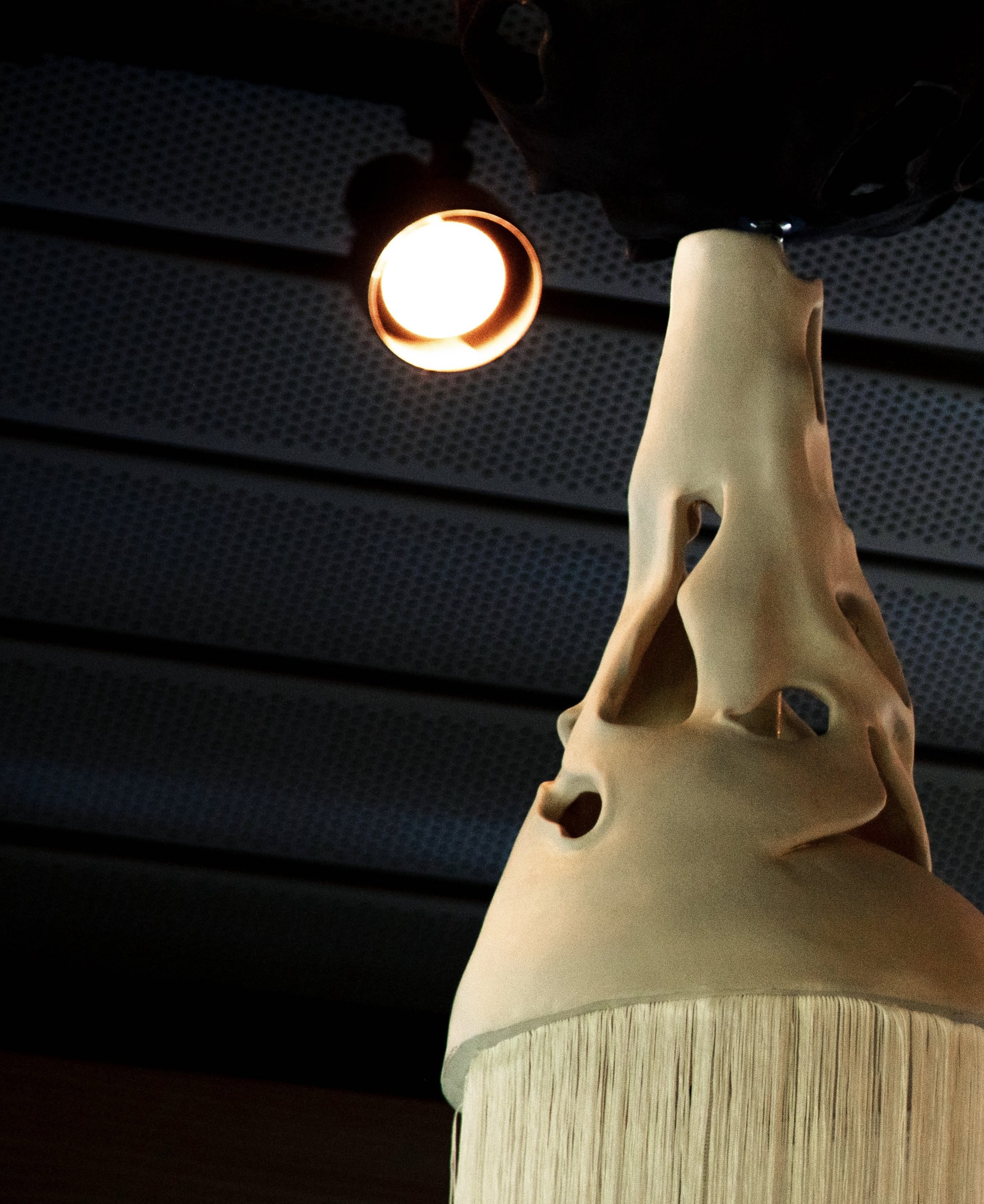 Left Facing Totem - Installation View, Totems at The Umlauf Sculpture Museum and Gardens, Porcelain, Spanish Shawl Tassel, Mother's Clothing, Photo Credit: Ian Clennan