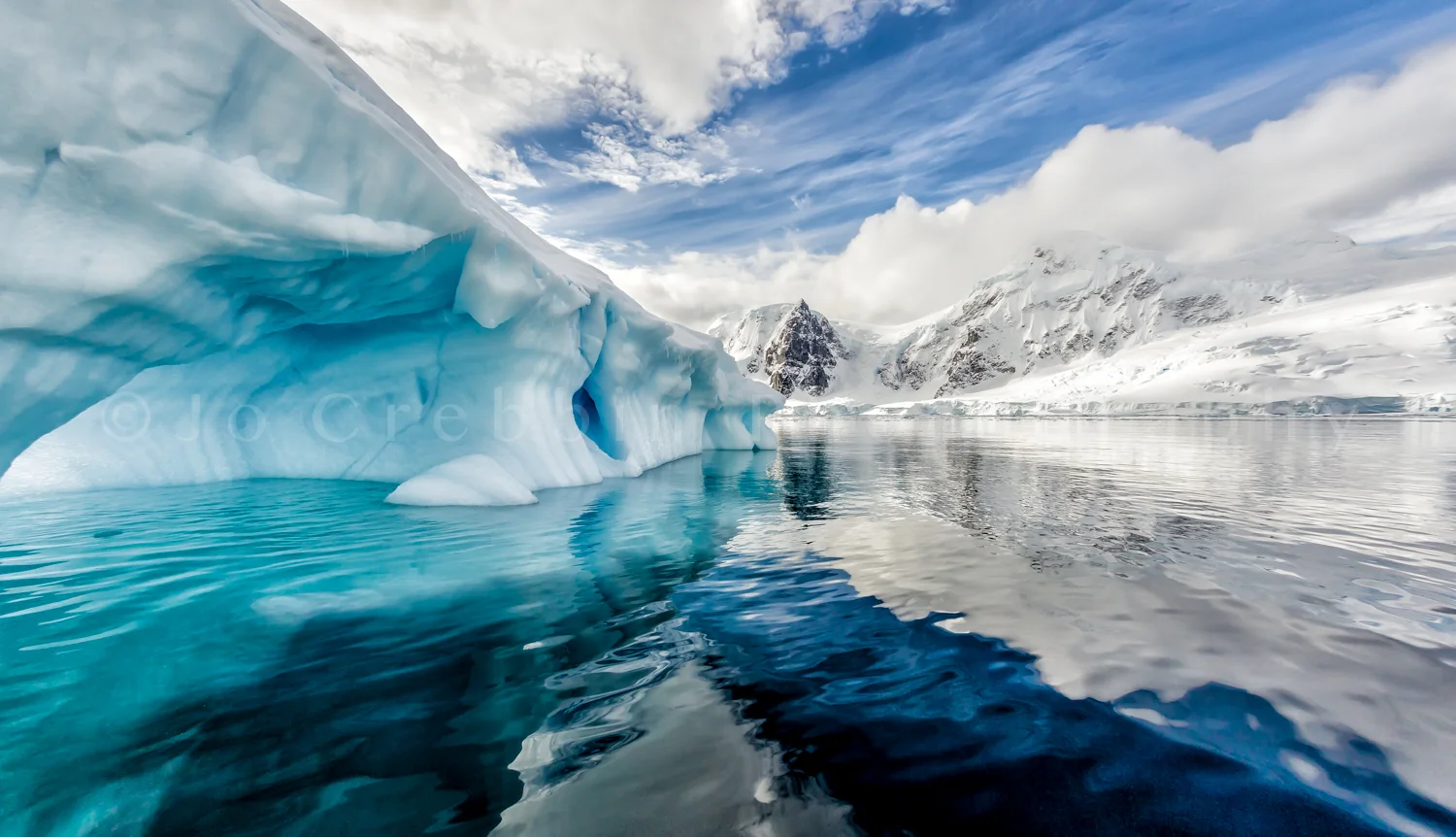 Iceberg floats in Andord Bay on Graham Land, Antarctica-Edit.jpg