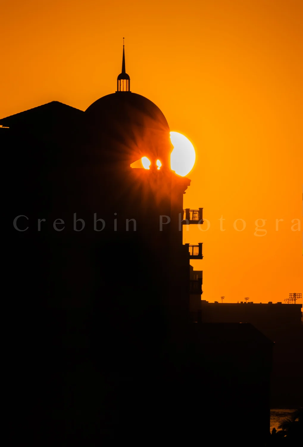 Sun just peaking through windows of Sarasota skyline at dawn.jpg