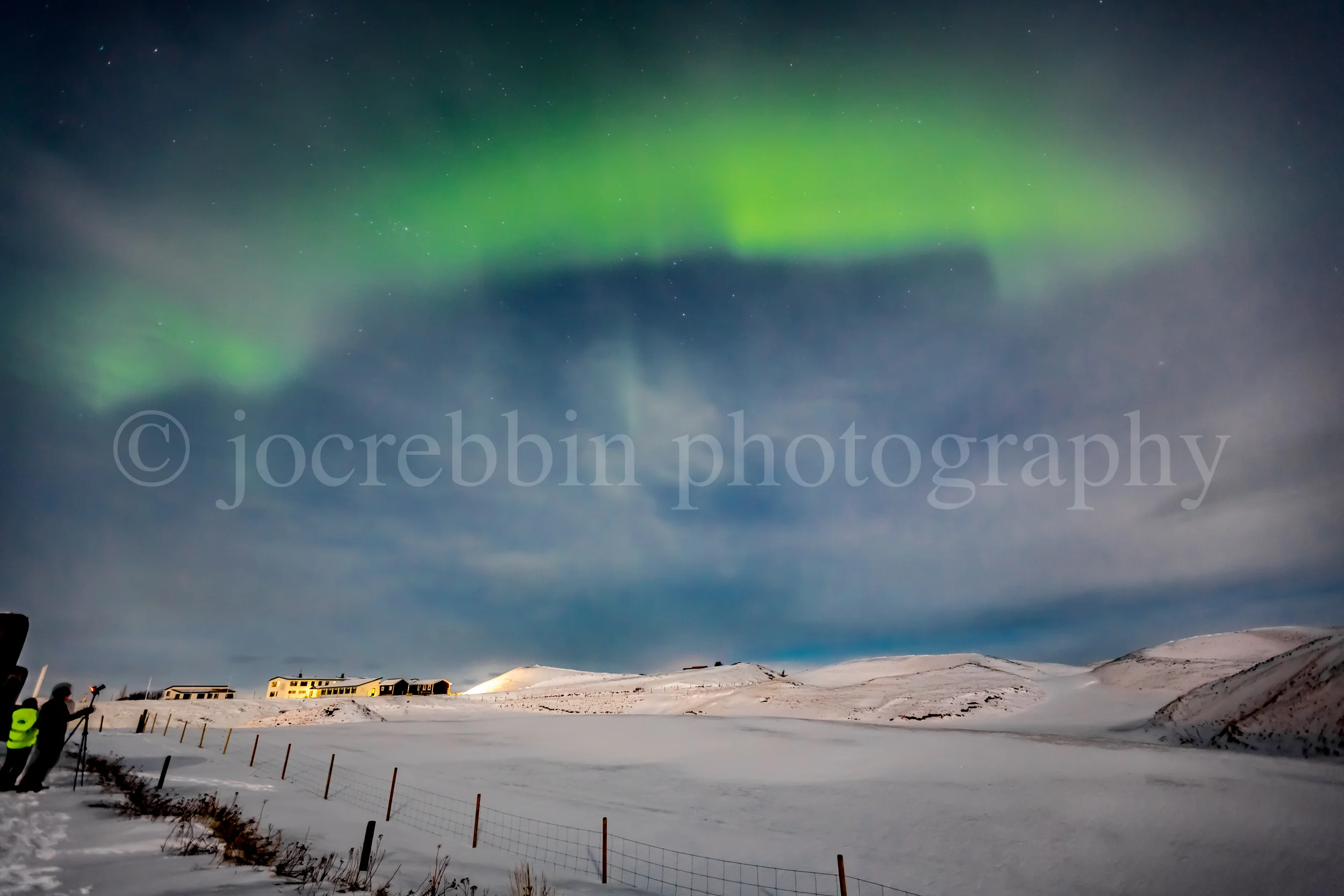 Green color fills the sky of northern lights in Iceland in February.jpg