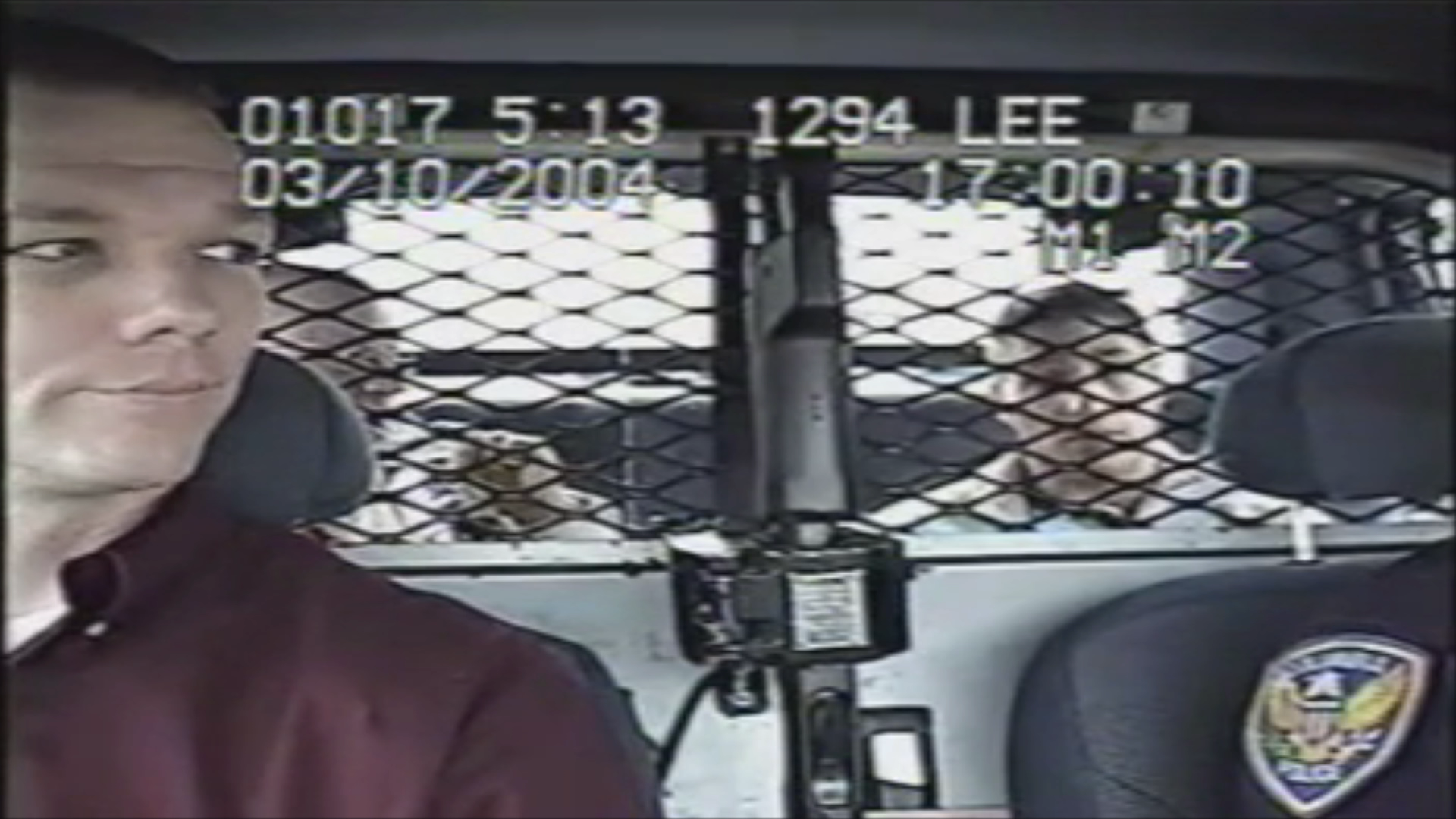 10-Ryan in squad car.png