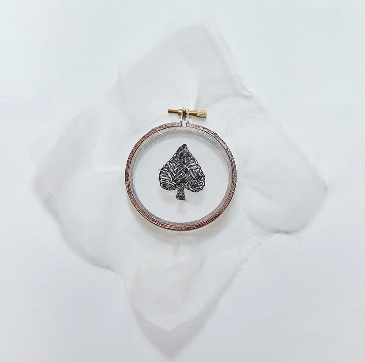 Spade , 2016 | Human hair on silk organza in wooden embroidery hoop | 5.5" x 5" 