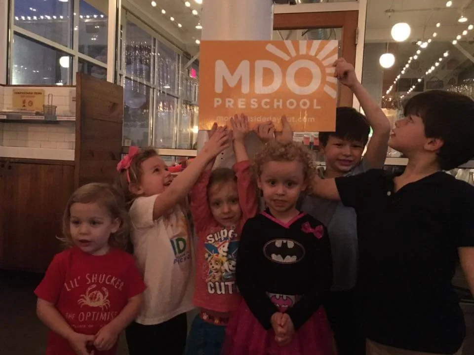MDO students (and alumni) at Yeah! Burger showing school spirit!