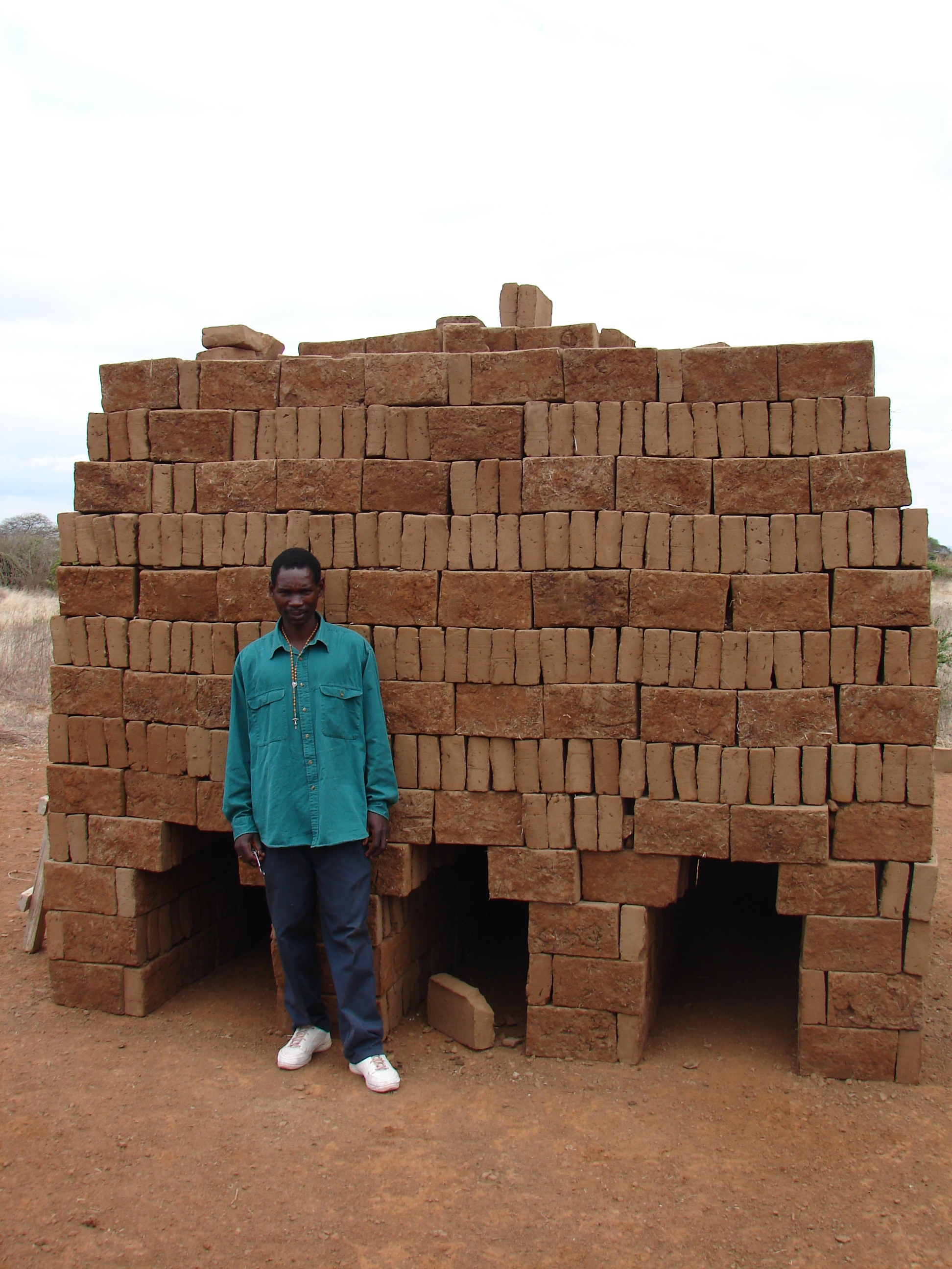 Clay bricks cut from the ground and stacked in preparation to be fired