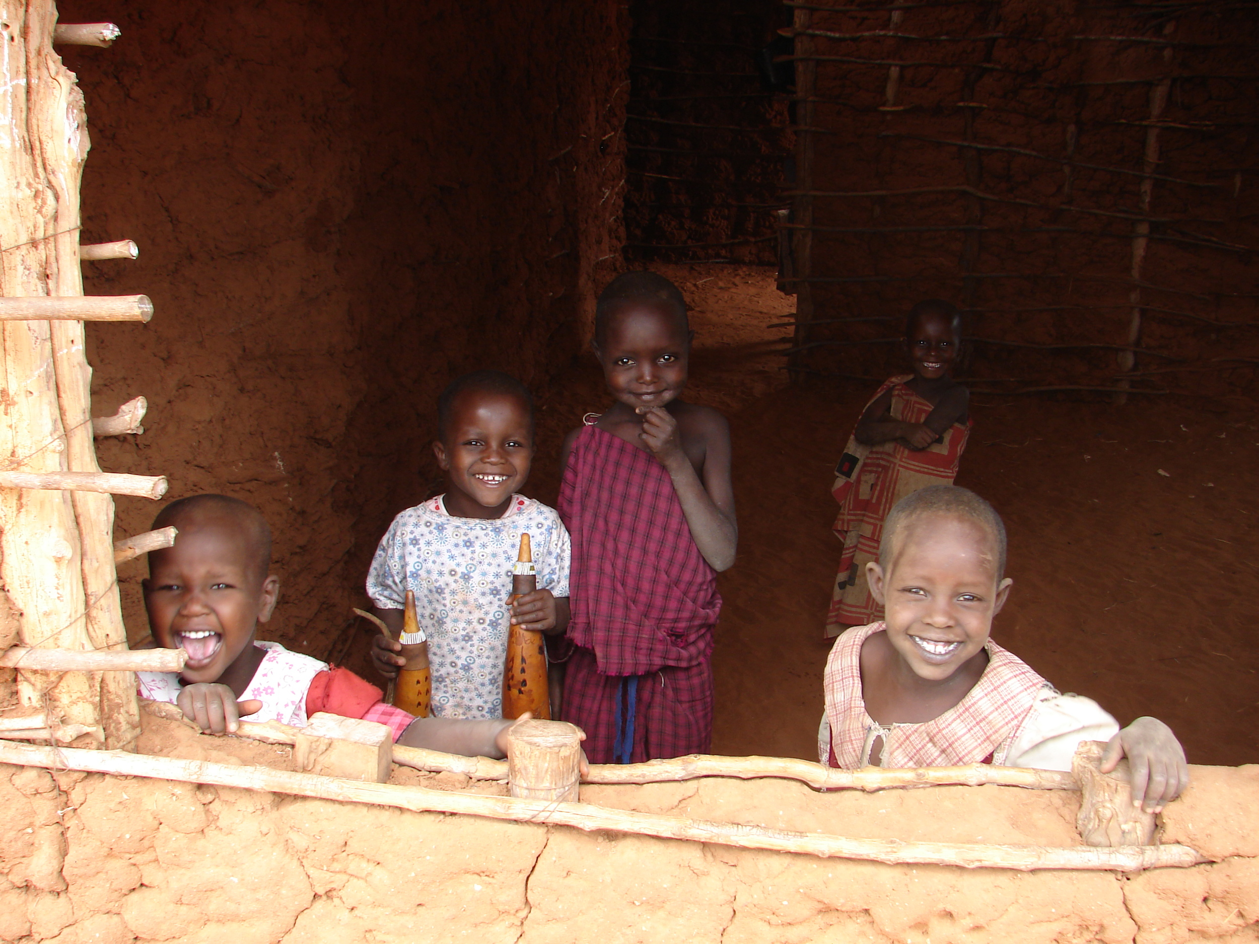 Masai children play in their family home - Tanzania