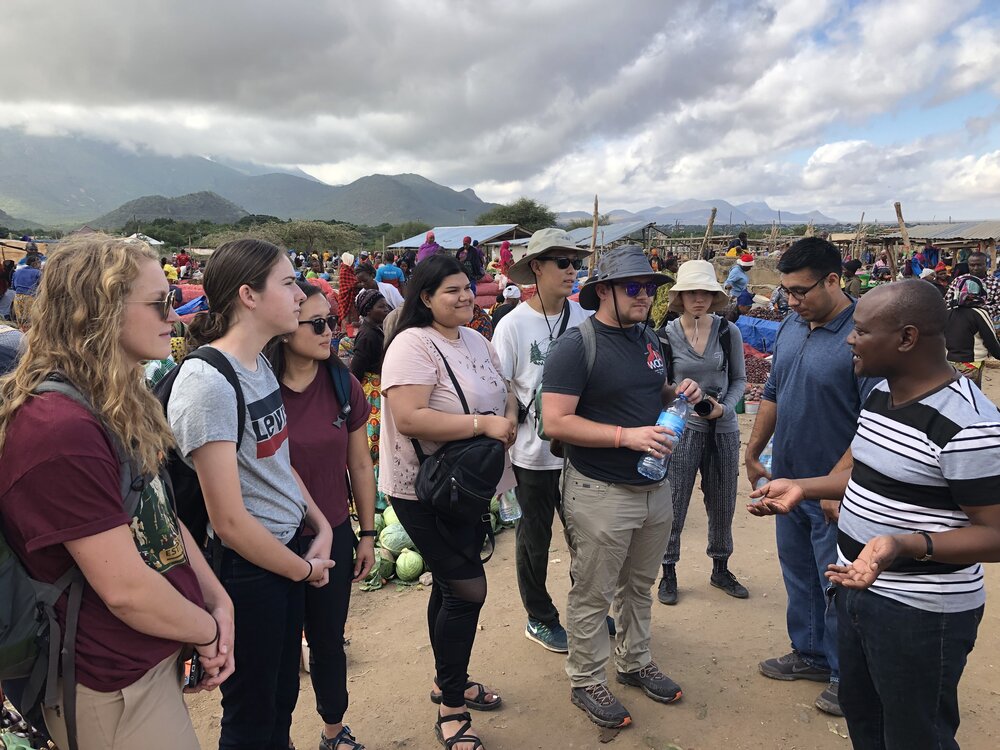 The Cal Poly students get a guided tour of the Same Sunday Market from local guide Amana Kazoka