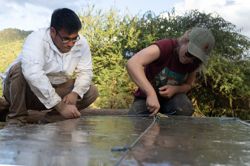 Architectural engineering students Erick (left) and Maja (right) install anchor bolts into the other foundation