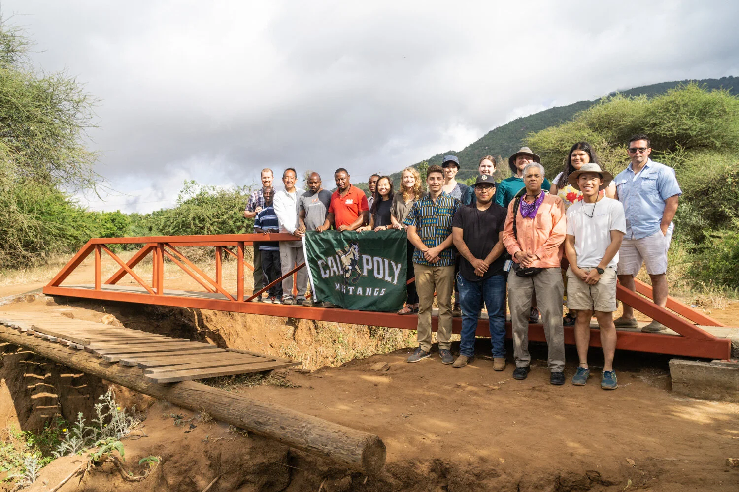 Mbesese construction crew and staff with the volunteer team on the completed bridge