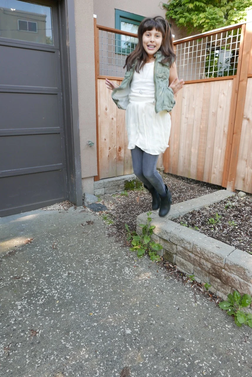 green khaki vest with a dress