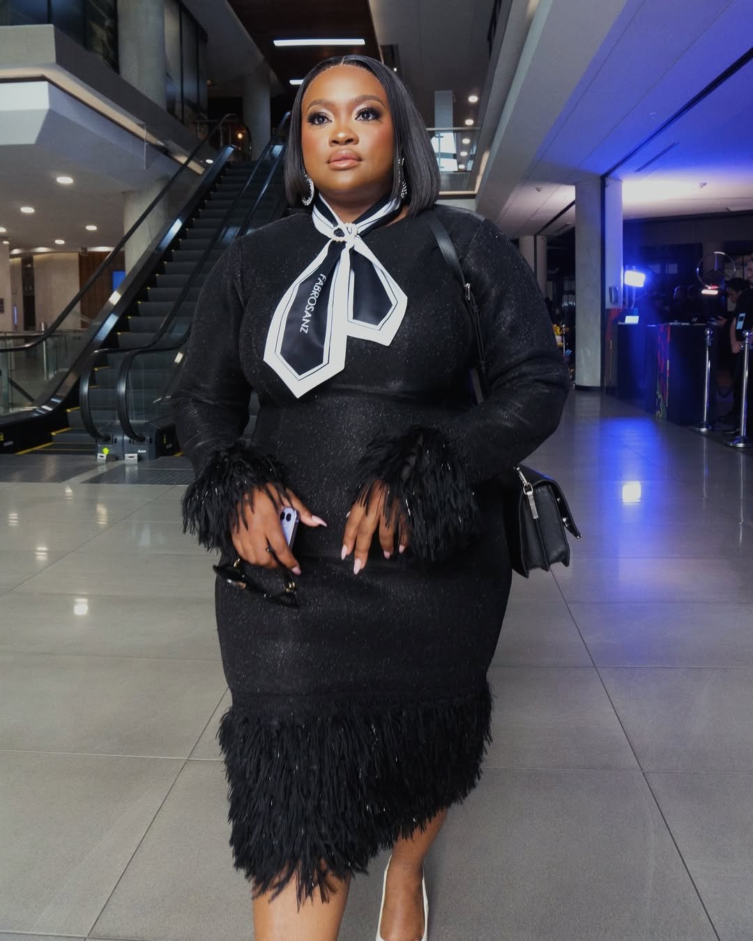 Black scuba dresswith feather