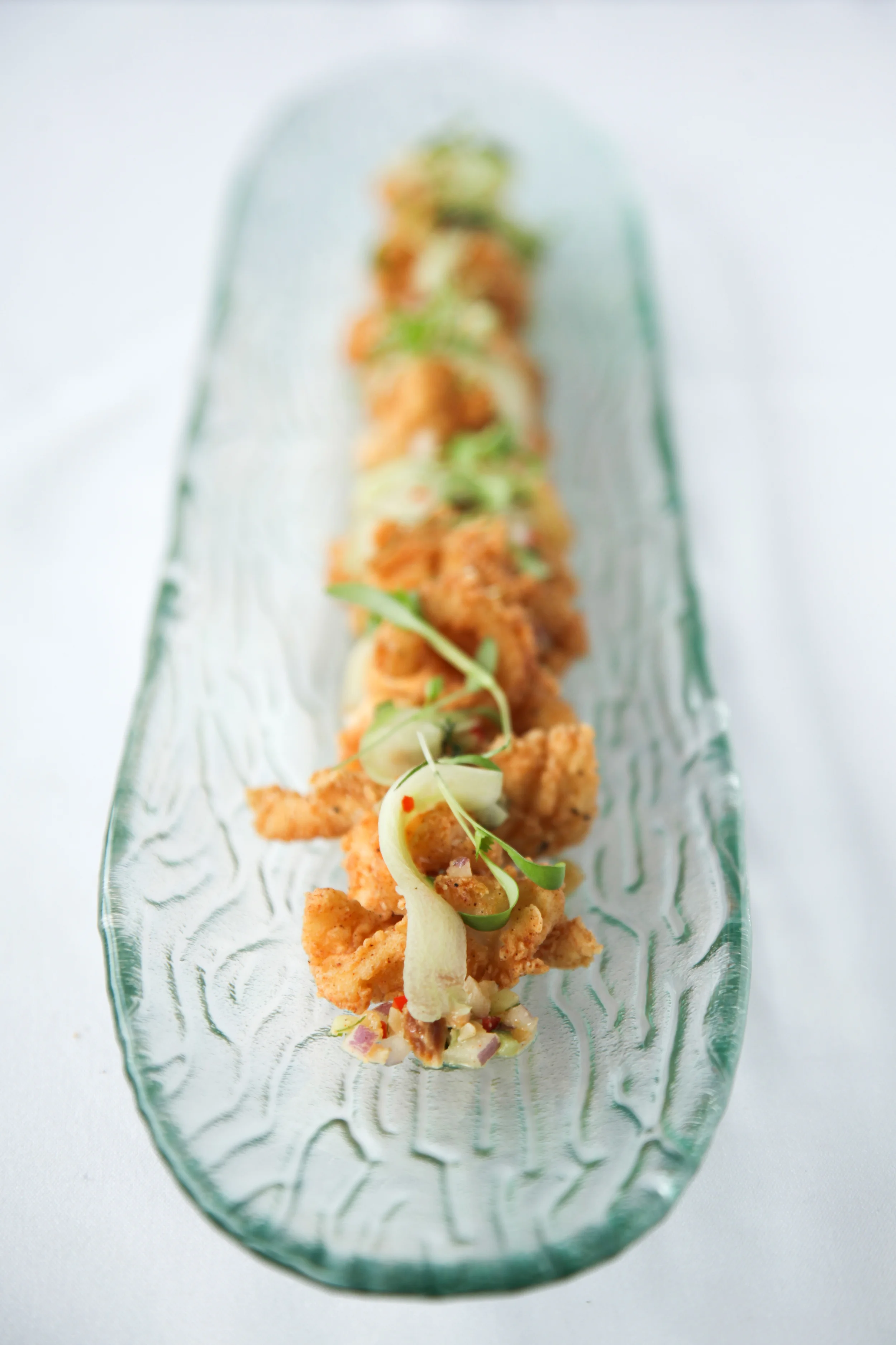 Spiced calamari, peanut cucumber relish, chilli caramel, nam jim, coriander & mint