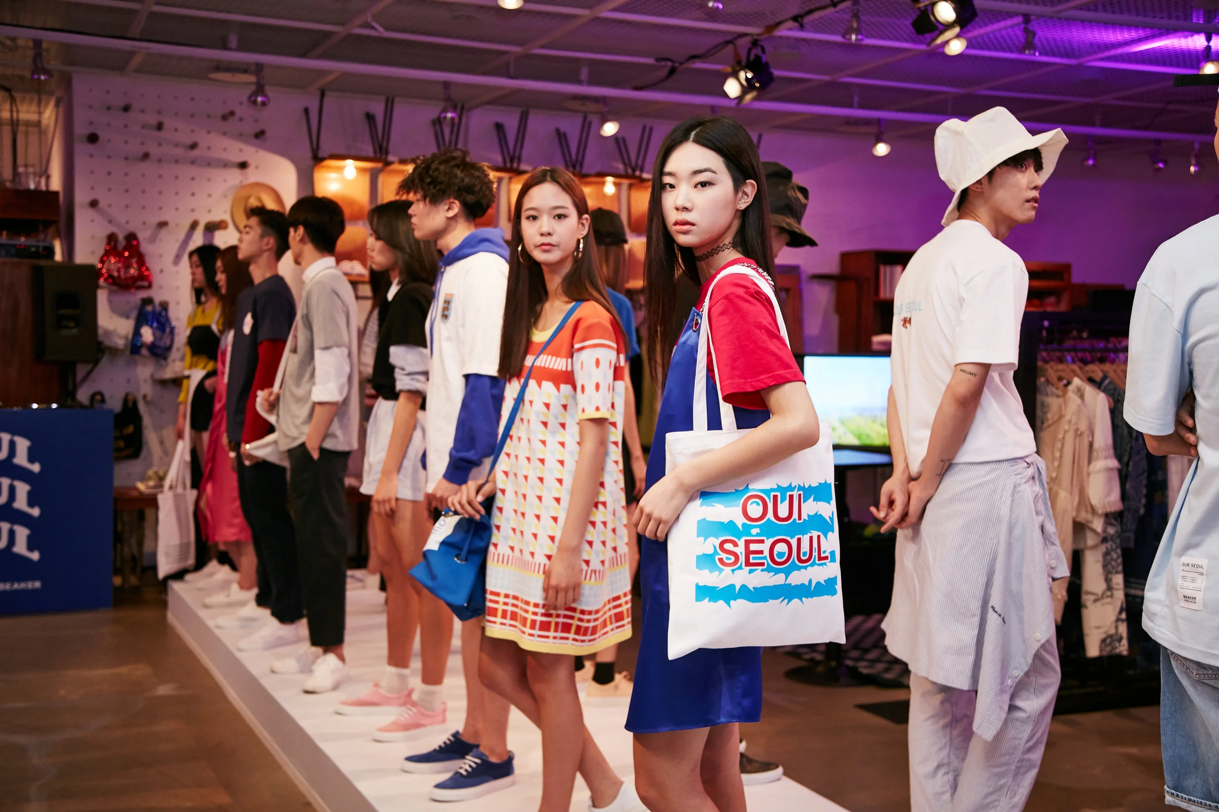Mini catwalk with models styled by the Korean designers