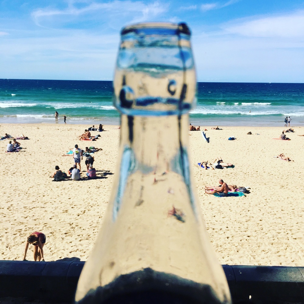 Bottled water, drink at room temperature to stop your tummy getting a shock in the heat.