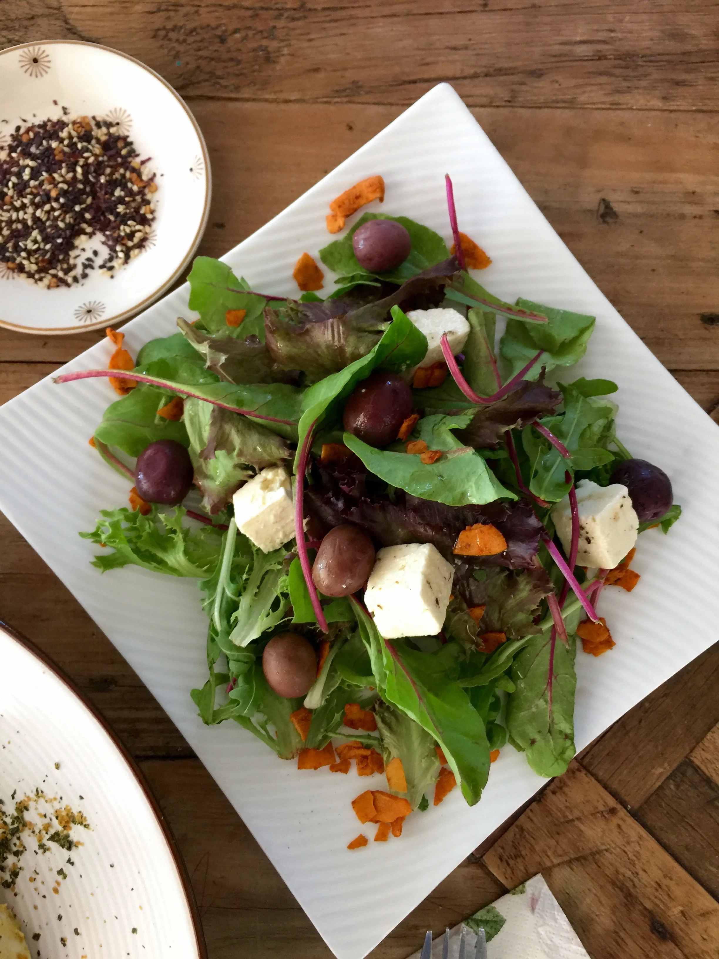 A really healthy salad with feta, black olives and coconut bacon, which tastes like the real thing.