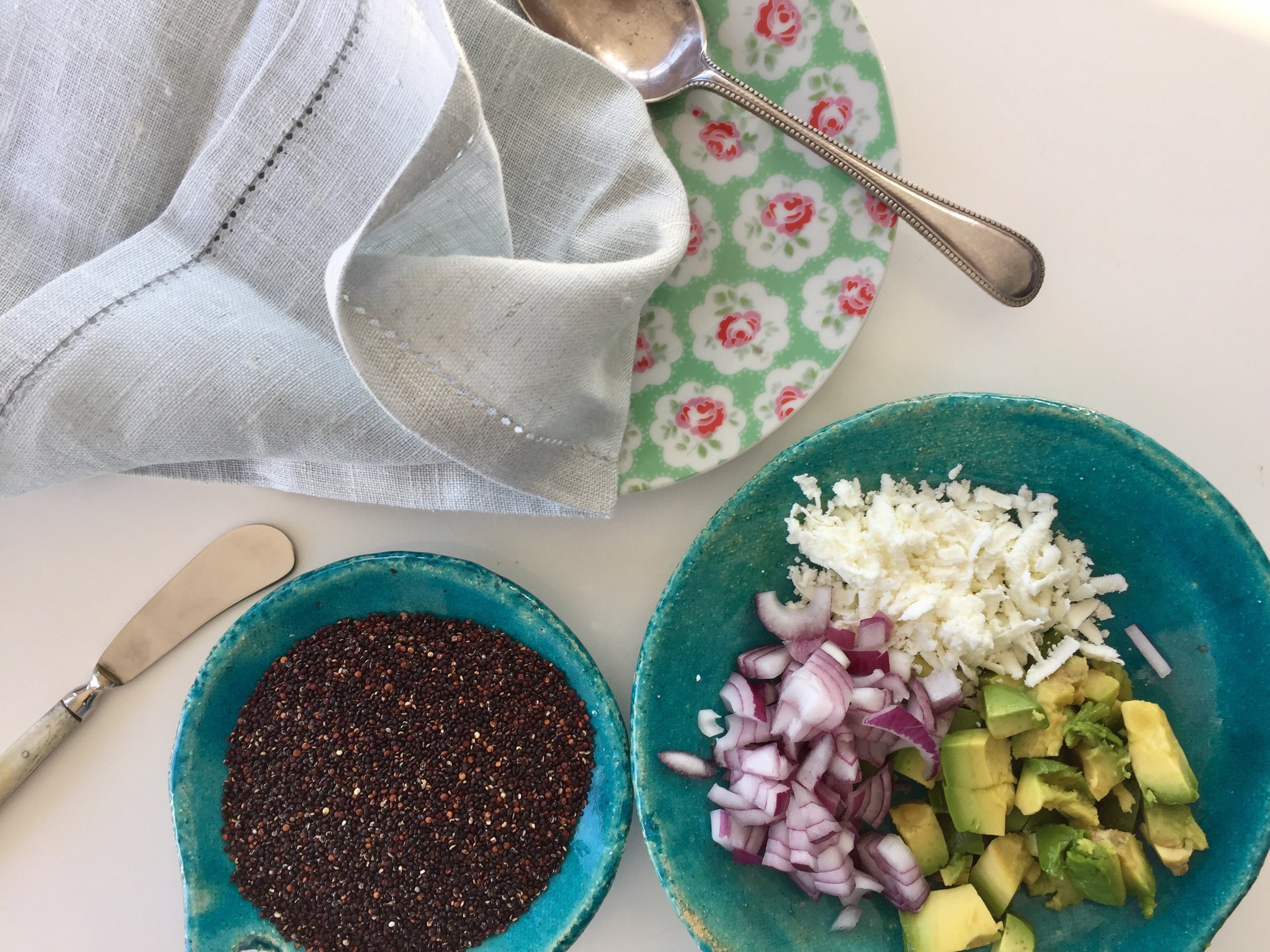 Ingredients for my current favourite salad: black quinoa, avo, red onion & goats cheese.