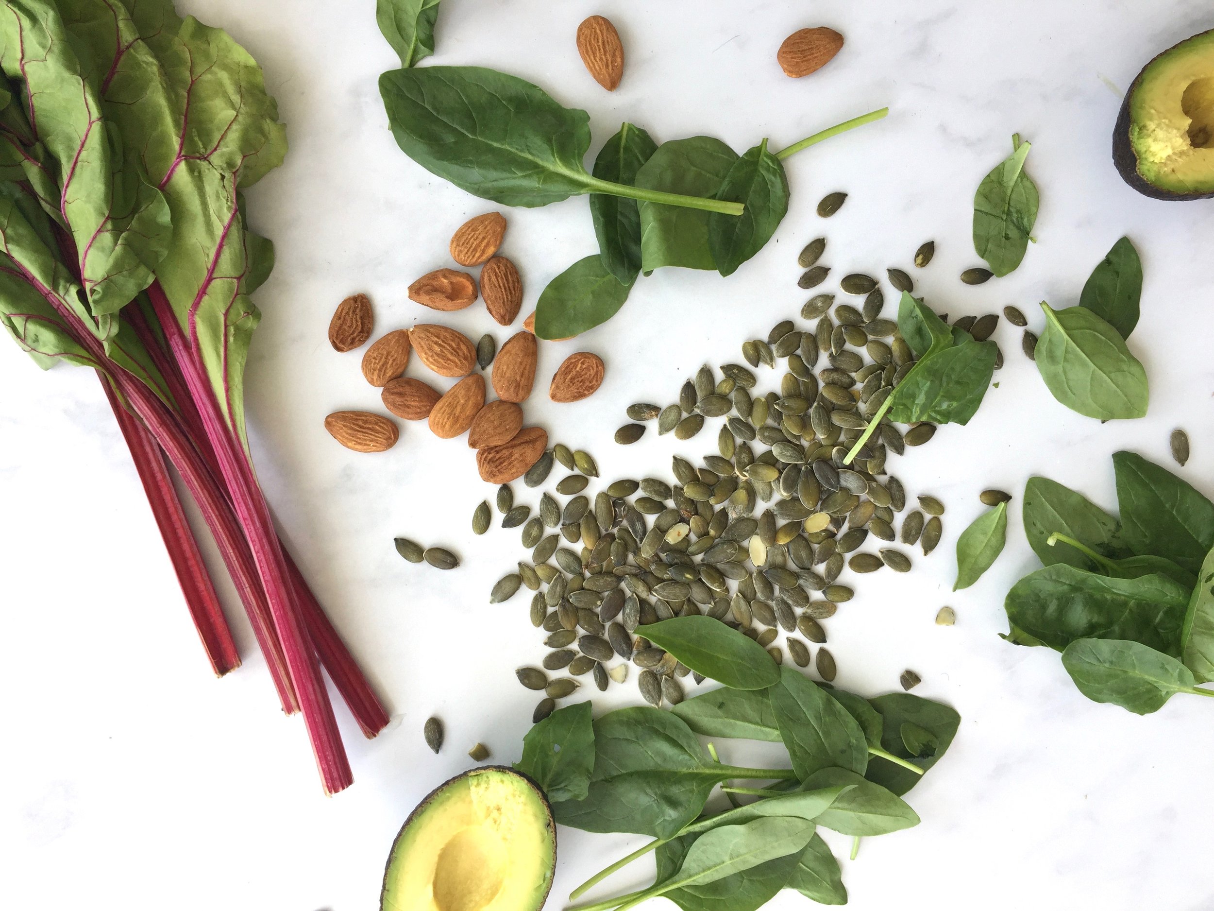 Magnesium-rich foods: Swiss chard, spinach, almonds, pumpkin seeds & avocado.