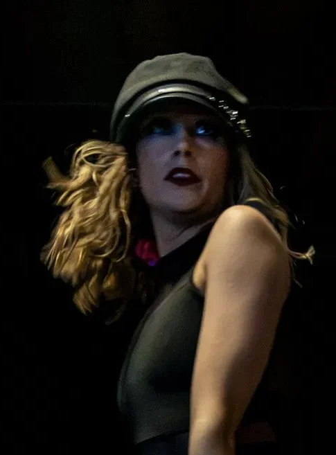 Close-up of the performer after AI Denoise in Camera Raw, clean but soft