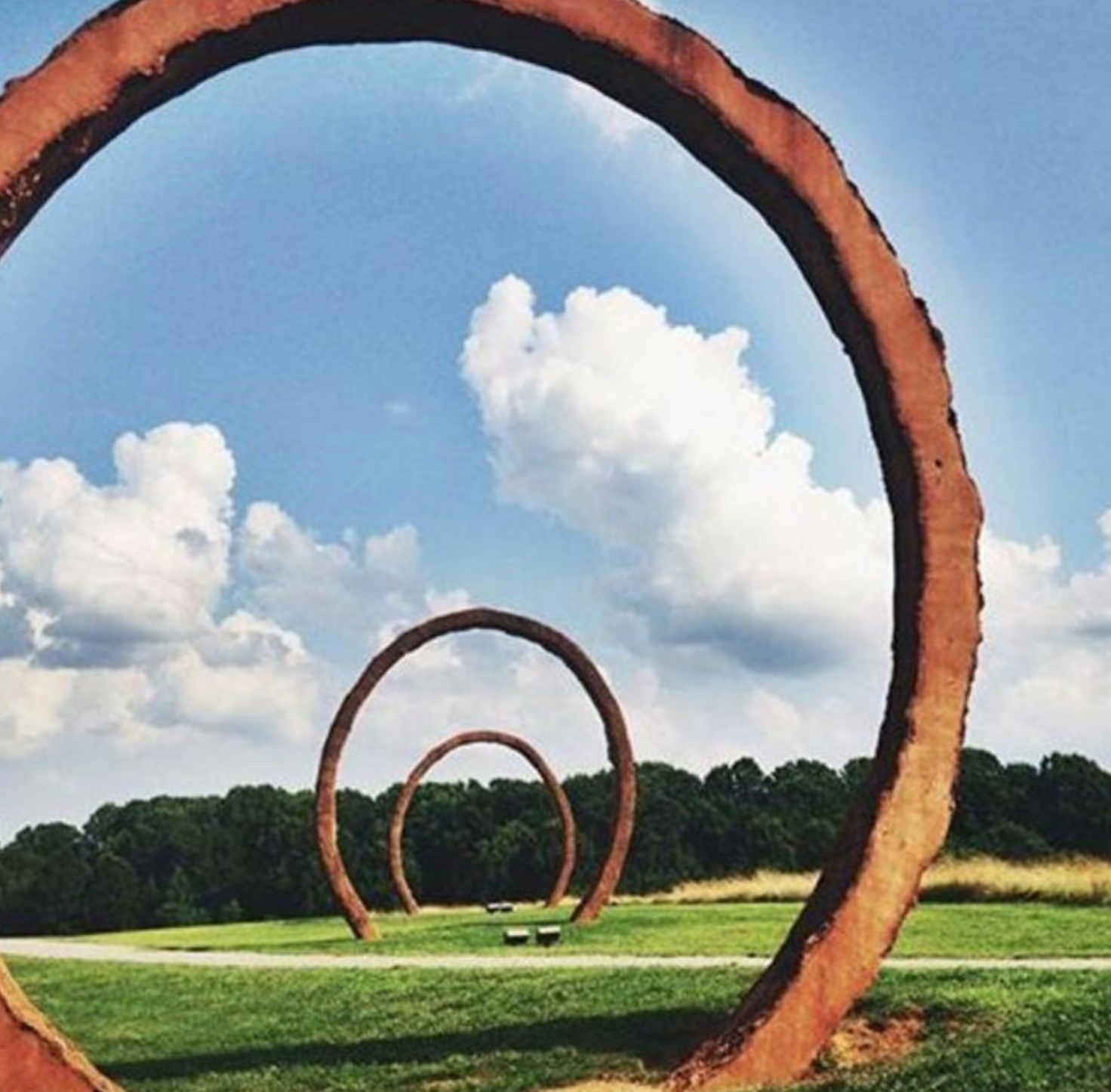 MASSIVE WORKS OF ART LINE THE GREENWAY BIKE TRAIL AT THE NORTH CAROLINA MUSEUM OF ART.